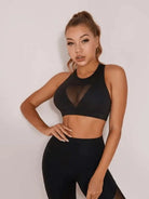 Black patchwork sports bra by Lumina Vancouver, stylish and supportive sports bra with a trendy patchwork design.