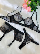 Sheer black and champagne embroidered lace lingerie set with three pieces from Lumina Vancouver, featuring delicate lace details.