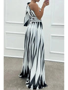 Elegant white striped one-shoulder maxi dress from Lumina Vancouver, featuring a flowing silhouette and stylish design.