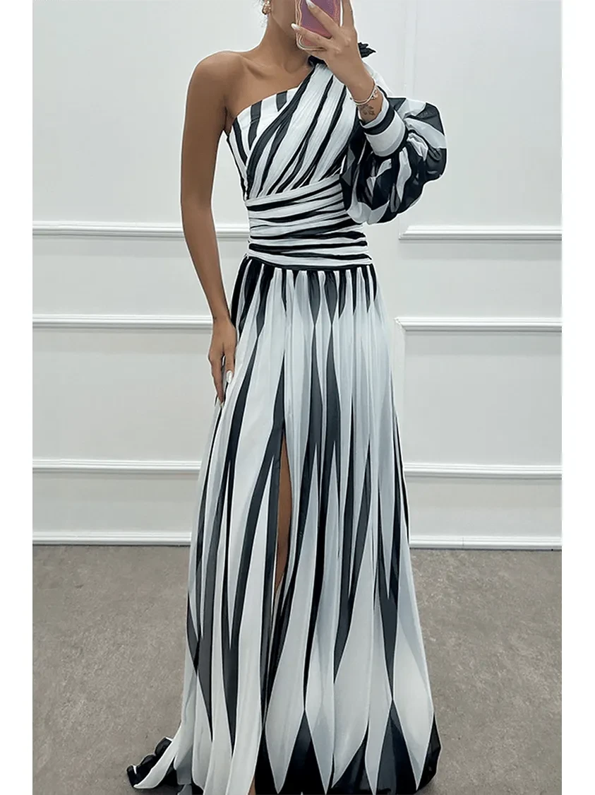 Lumina Vancouver Shiloh elegant striped one-shoulder maxi dress in white, flowing and stylish for formal occasions.