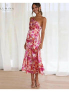 Orange floral patterned Tiphaine dress by Lumina Vancouver, showcasing a stylish and vibrant women's dress with floral details.