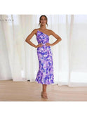 Lumina Wear Tiphaine floral pattern dress in orange, showcasing a stylish and vibrant design perfect for warm weather.