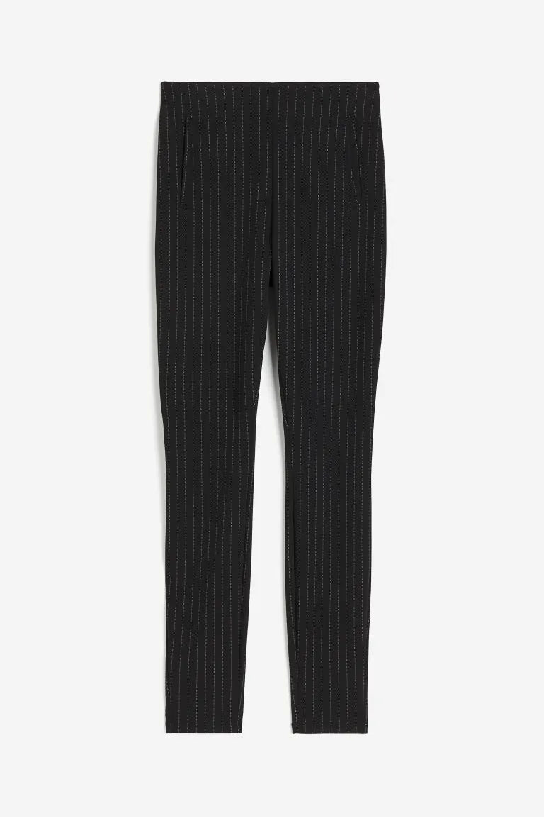 Elegant fitted black Lumina Wear trousers with stretch fabric, featuring subtle stripe details and a sleek, tailored design.