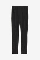 Elegant fitted black Lumina Wear trousers with stretch fabric, featuring subtle stripe details and a sleek, tailored design.