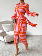 Lumina Vancouver Solana™ printed wrap dress in orange and pink with floral pattern, stylish and lightweight for warm weather.