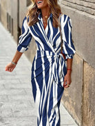 Lumina Vancouver Solana™ printed wrap dress in orange and pink, showcasing a stylish, flowy design perfect for warm-weather wear.