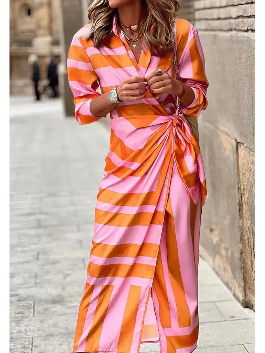 Lumina Vancouver Solana™ printed wrap dress in orange and pink fabric, featuring a stylish design and flattering fit.