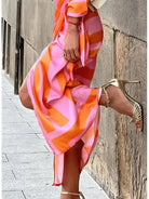 Lumina Vancouver Solana™ printed wrap dress in orange and pink, lightweight fabric, stylish design, perfect for summer wear.