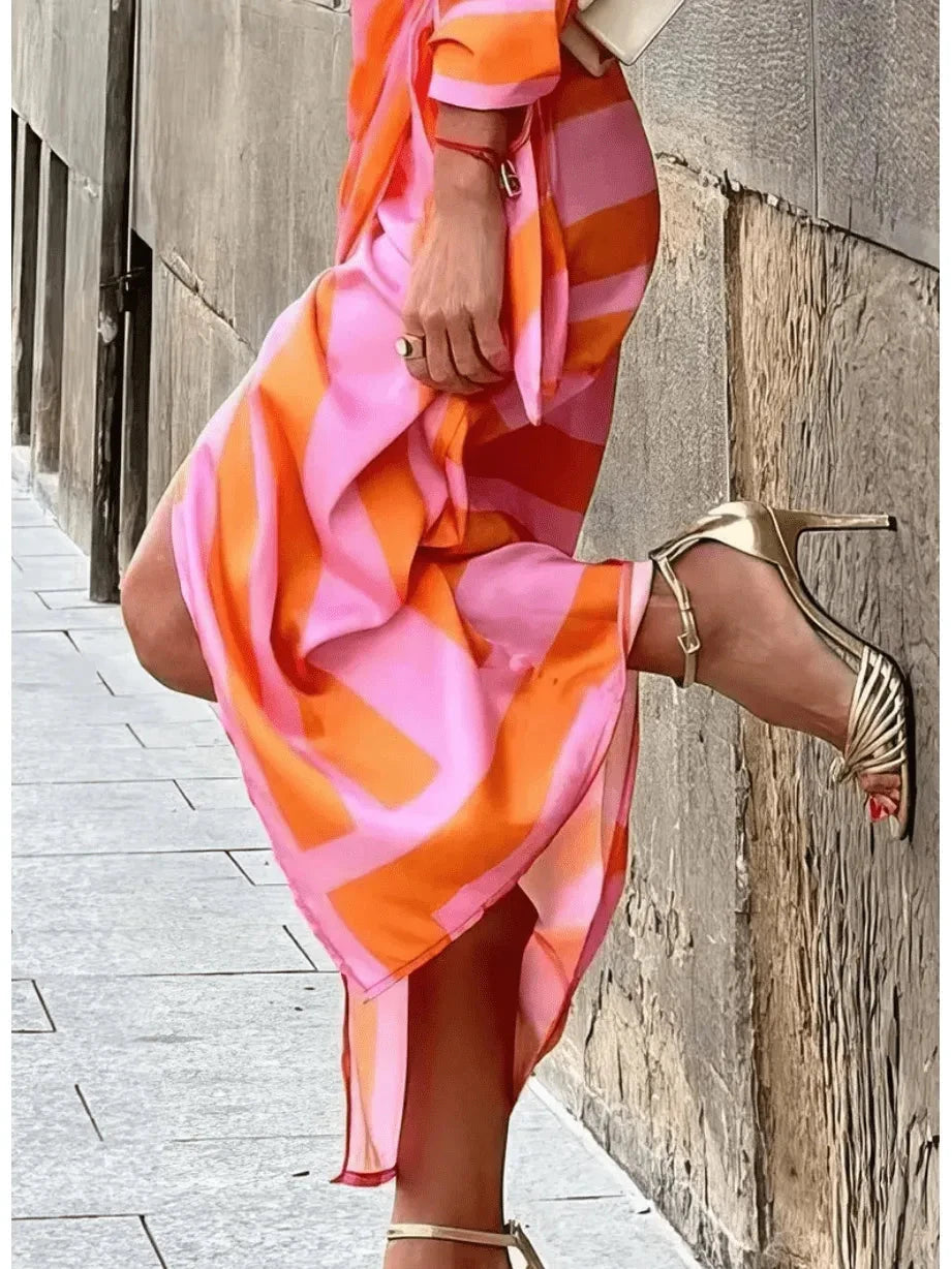 Lumina Vancouver Solana™ printed wrap dress in orange and pink, lightweight fabric, stylish design, perfect for summer wear.