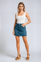 White Sophia bow-detail cami top with zipper closure by Lumina Wear, women's sleeveless top with delicate bow accents.