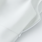 White Lumina Wear Sophia bow-detail cami top with zipper closure, women's sleeveless top, close-up of bow and zipper details.
