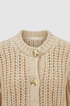 Light beige Lumina Wear Sophia women's knit cardigan with a relaxed fit, soft texture, perfect for casual and cozy styling.