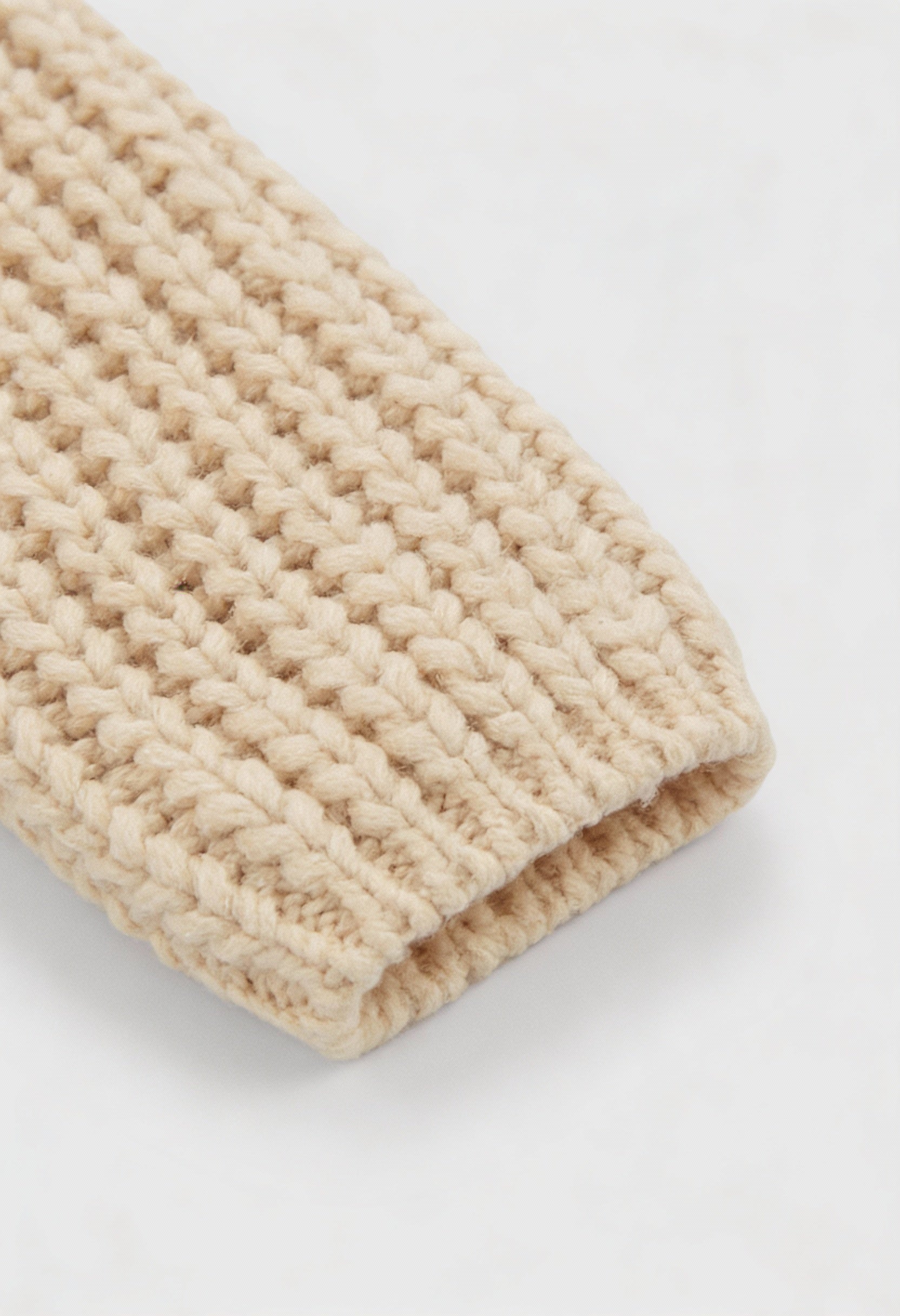 Sophia beige knit cardigan for women by Lumina Wear, featuring a cozy, relaxed fit and soft, textured fabric.