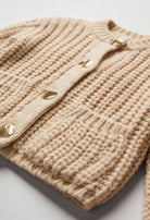 Lumina Wear Sophia beige knit cardigan for women, relaxed fit, cozy and stylish, displayed on a model.