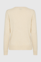 Beige V-neck women's sweater from Lumina Wear, featuring a cozy fit and flattering silhouette.