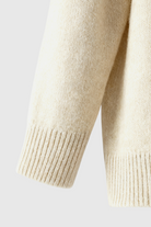 Sophia beige V-neck women's sweater by Lumina Wear featuring a cozy fit and flattering design, displayed on a neutral background.