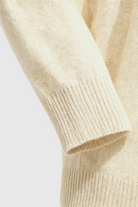 Sophia beige V-neck women's sweater by Lumina Wear featuring a cozy, flattering fit and soft knit fabric.