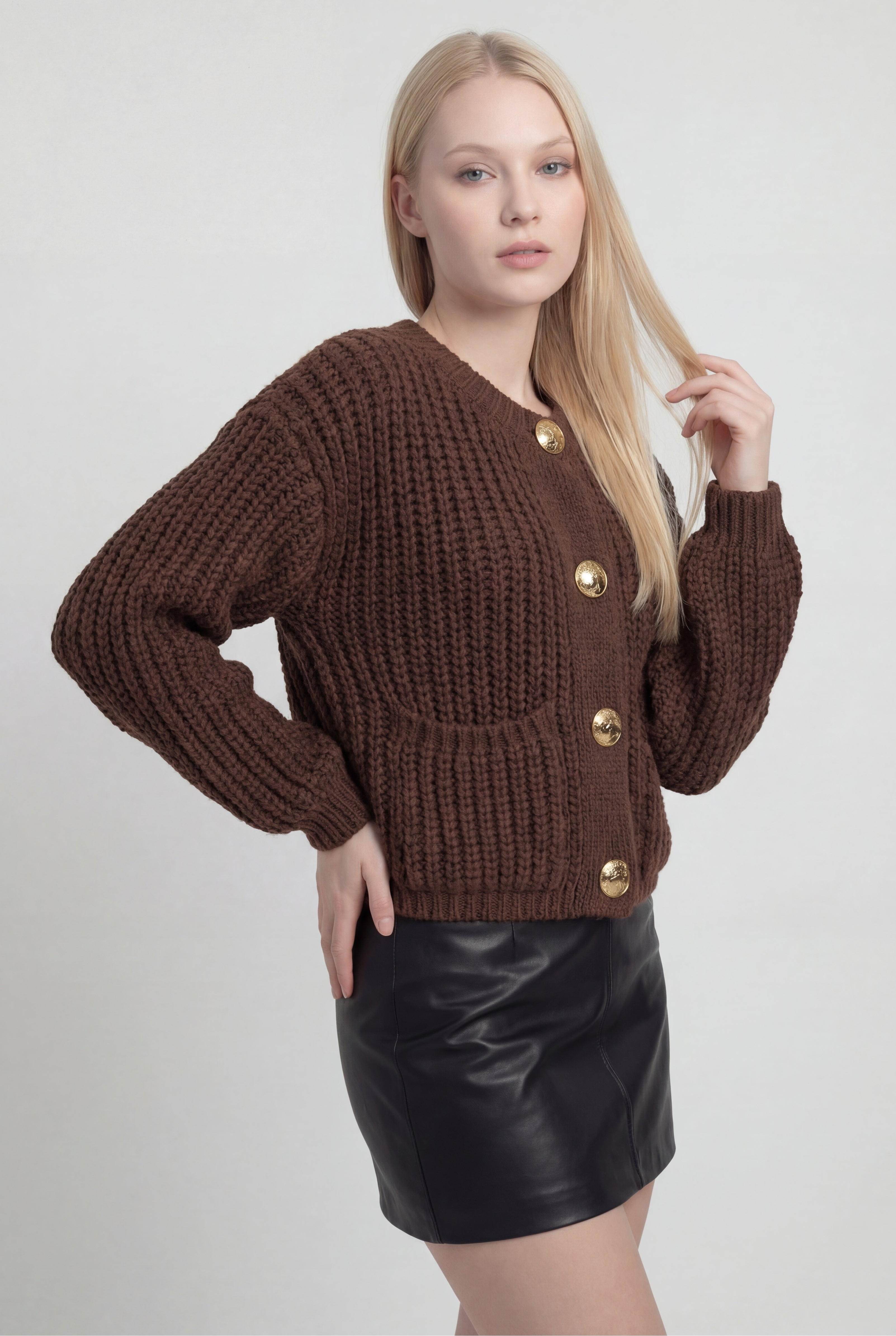 Sophia Lumina cozy brown knit cardigan with relaxed fit, featuring long sleeves and a soft, textured fabric for comfortable wear.