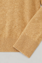 Sophia Lumina Wear cozy brown V-neck sweater with flattering fit, long sleeves and soft knit fabric, suitable for casual wear.