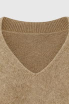 Lumina Wear Sophia cozy khaki knit sweater with V-neckline, featuring a soft, textured fabric and classic fit.