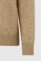 Lumina Wear Sophia cozy khaki knit sweater with V-neckline, featuring a soft, textured fabric and classic fit.