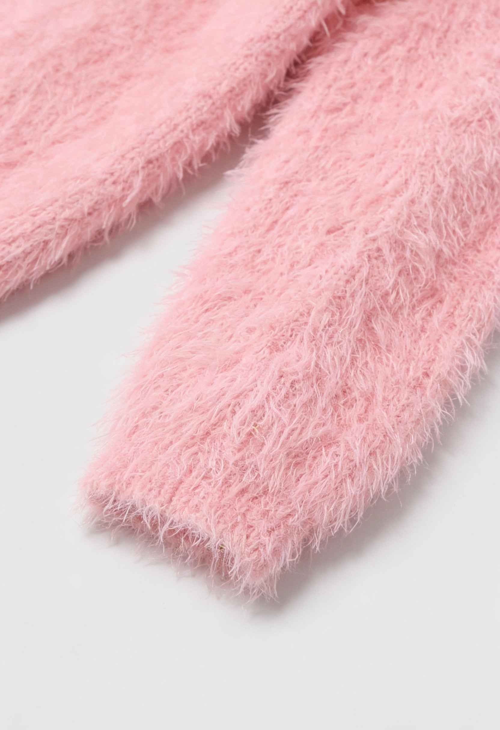 Pink knit cardigan from Lumina Wear featuring a cozy, versatile design perfect for layering and casual styling.