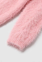 Pink knit cardigan from Lumina Wear featuring a cozy, versatile design perfect for layering and casual styling.