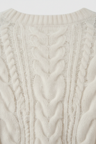 Lumina Wear Sophia cozy white cardigan sweater with relaxed fit and ribbed hem, soft knit fabric, displayed on a hanger.