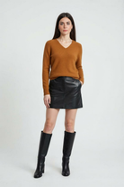 Lumina Wear Sophia cozy orange V-neck sweater with a flattering fit, shown on a model, ideal for casual stylish wear.