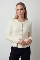 Sophia Lumina cozy white cardigan sweater with ruffle details, lightweight knit, perfect for casual or layered winter wear.