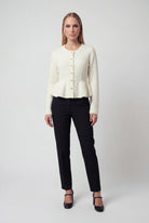 Sophia white cardigan sweater with ruffle details by Lumina Wear, featuring cozy knit fabric and stylish ruffle accents.