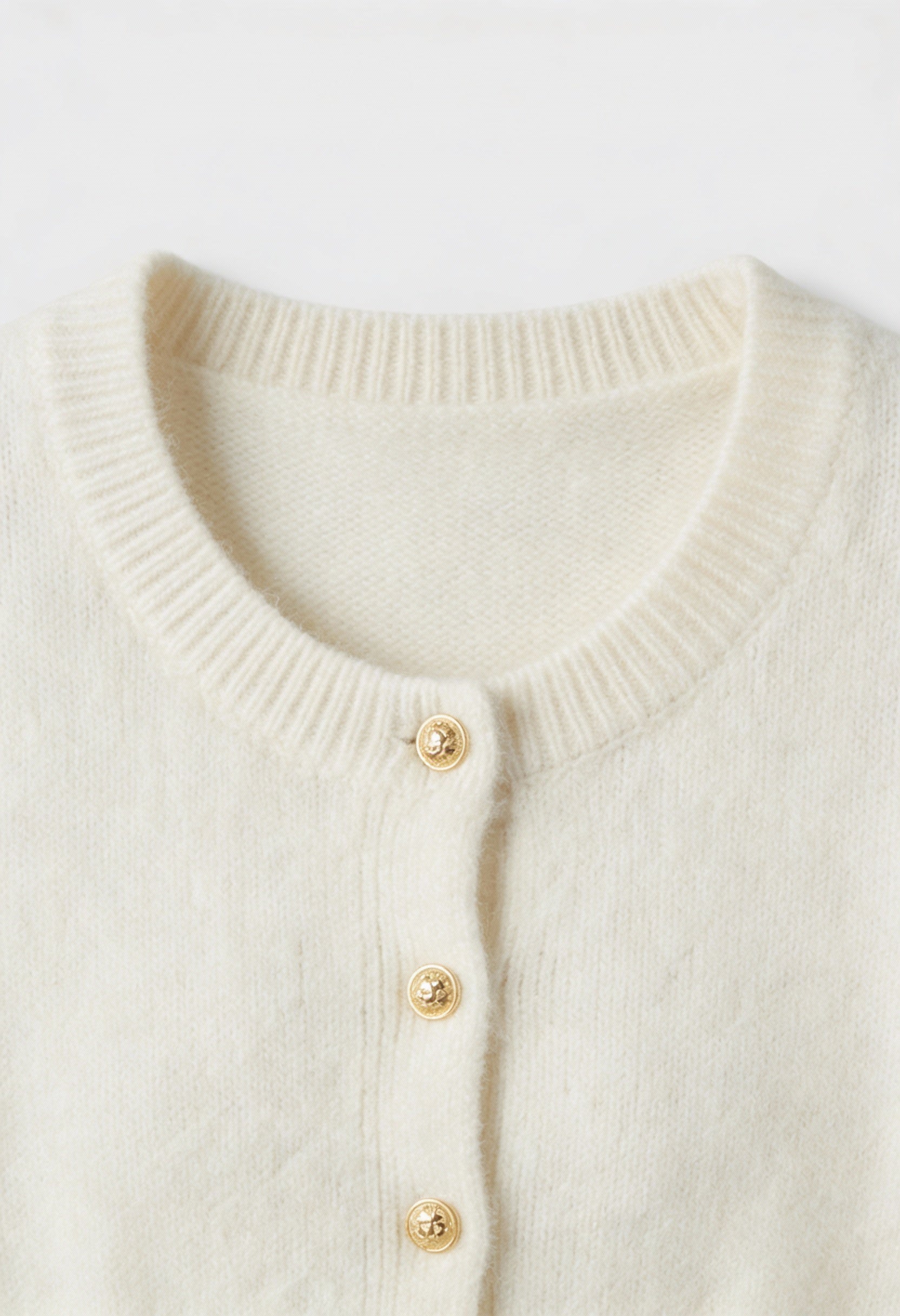 Sophia white cardigan sweater with ruffle details by Lumina Wear, cozy knit with stylish ruffle accents, perfect for casual wear.