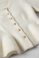 Sophia Lumina white cardigan sweater with ruffle details, cozy knit, long sleeves, perfect for casual wear.