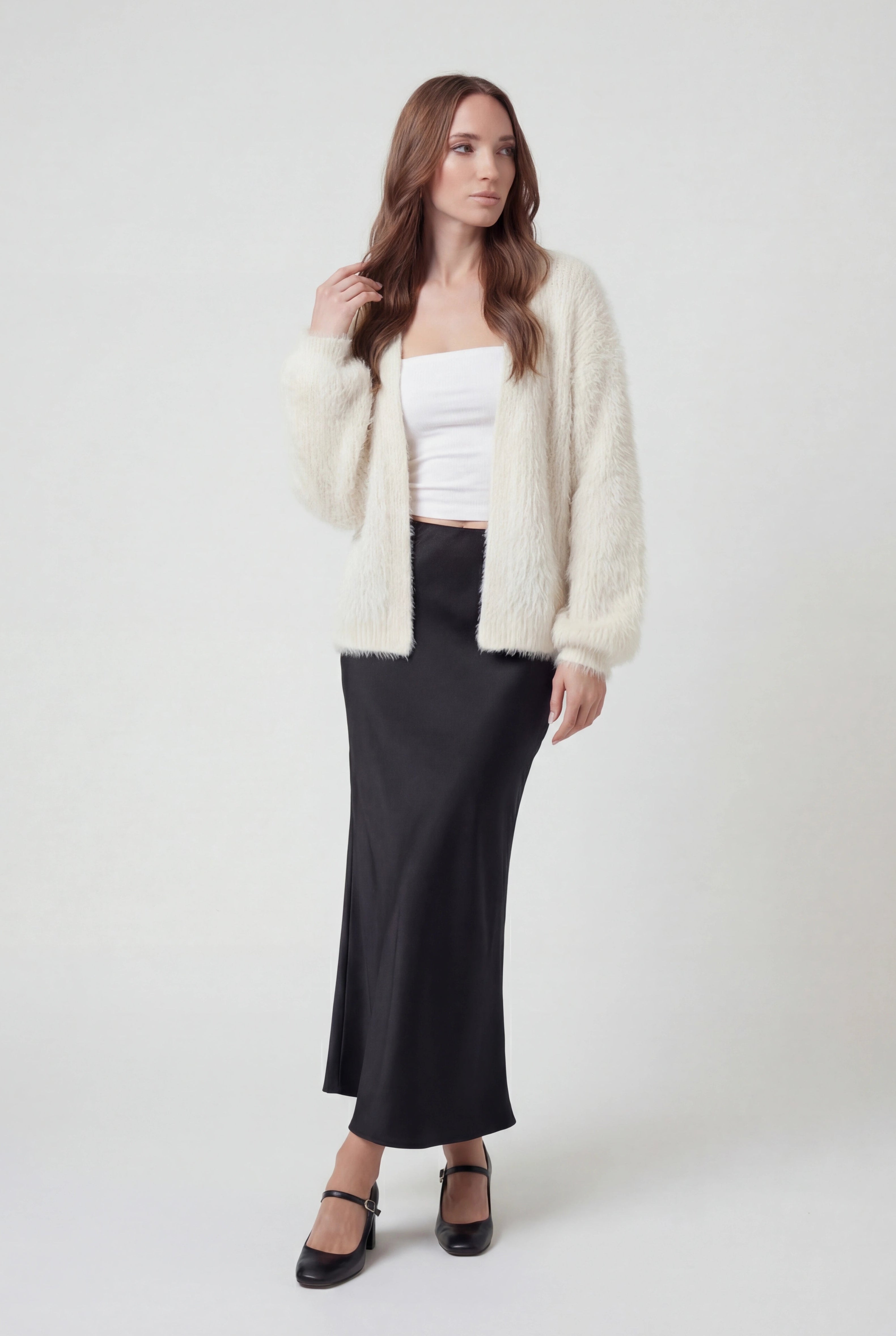 Sophia Lumina white knit cardigan with ribbed hem, cozy sweater featuring long sleeves and soft textured fabric.
