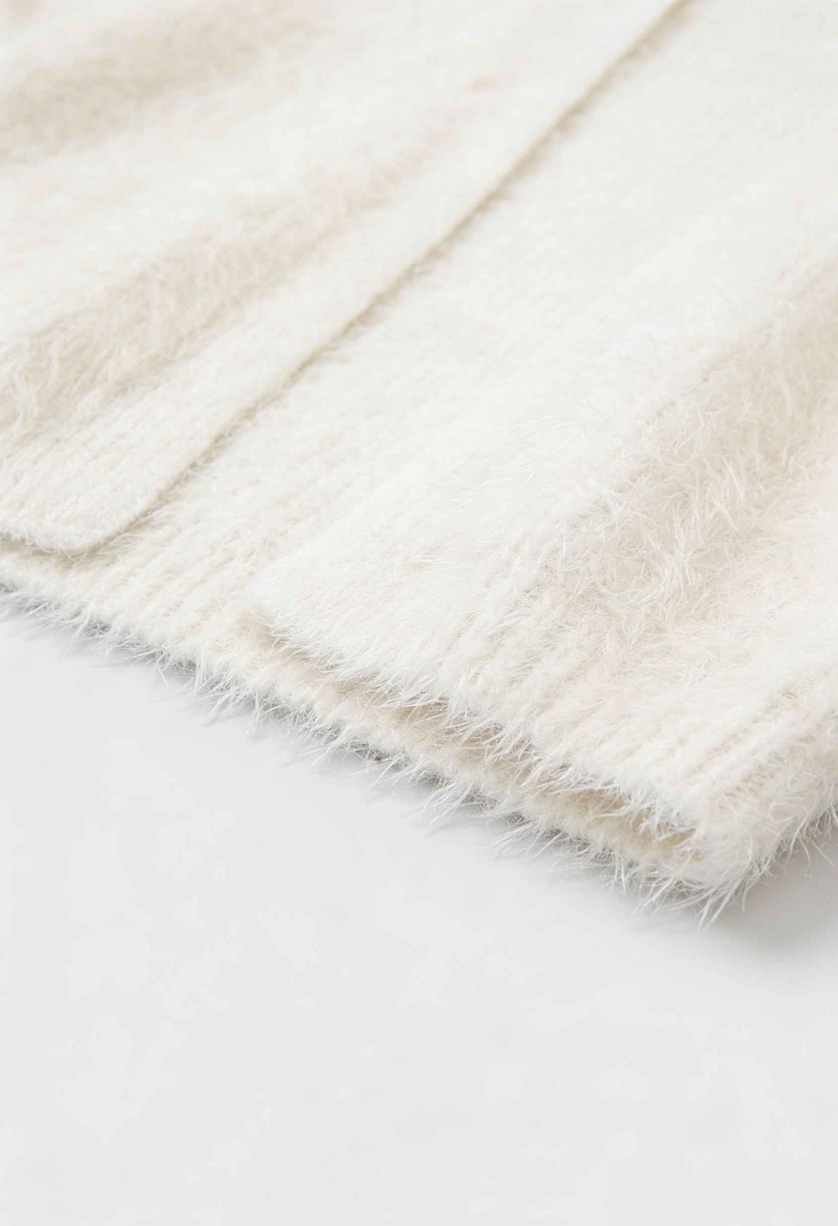 Lumina Wear Sophia white knit cardigan with ribbed hem, cozy sweater featuring long sleeves and a relaxed fit.