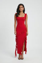 Red Sophia maxi dress with elegant backless design and high slit by Lumina Wear, flowing and stylish for formal occasions.