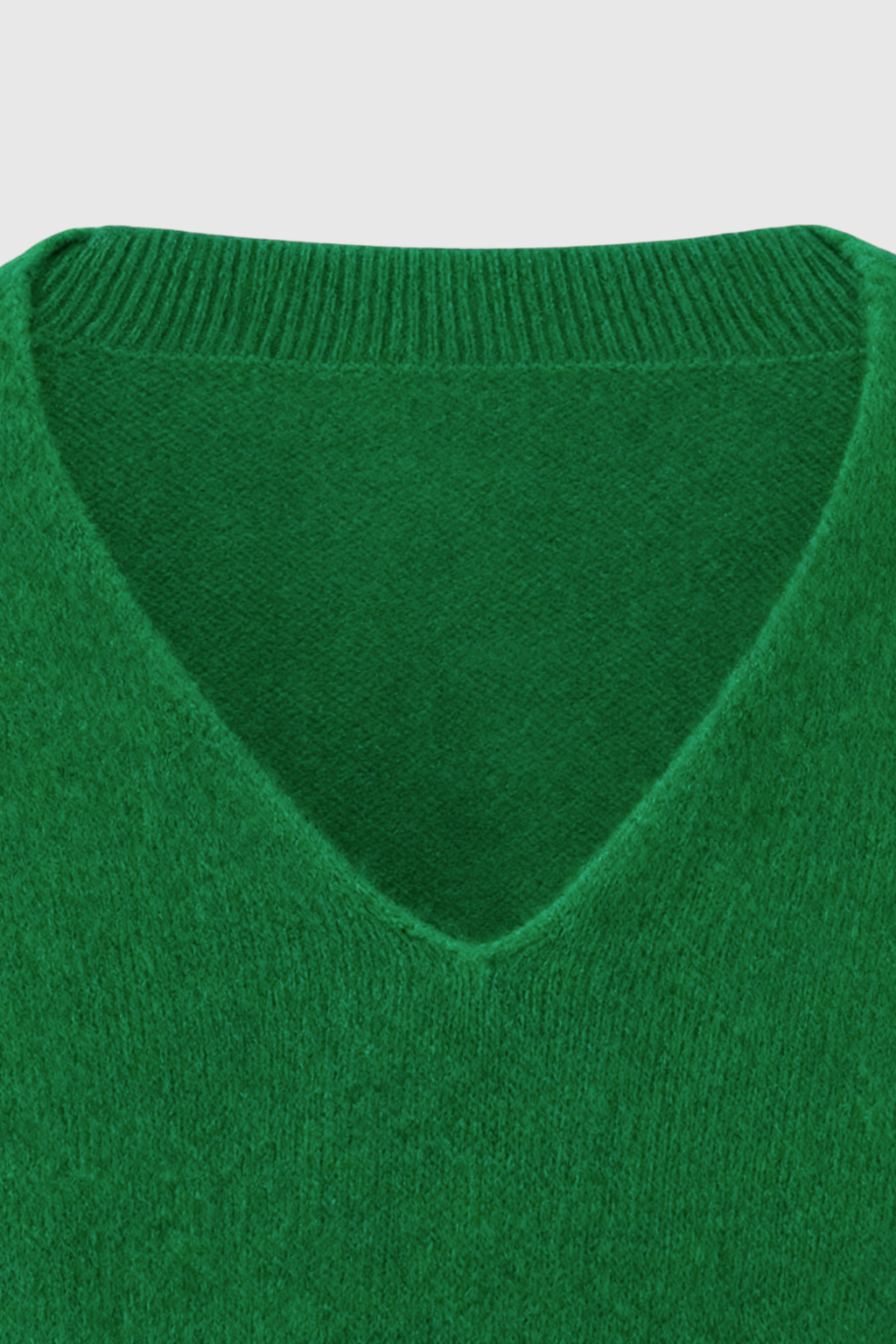 Lumina Wear Sophia green V-neck sweater with fitted silhouette, showcasing soft knit fabric and stylish design.