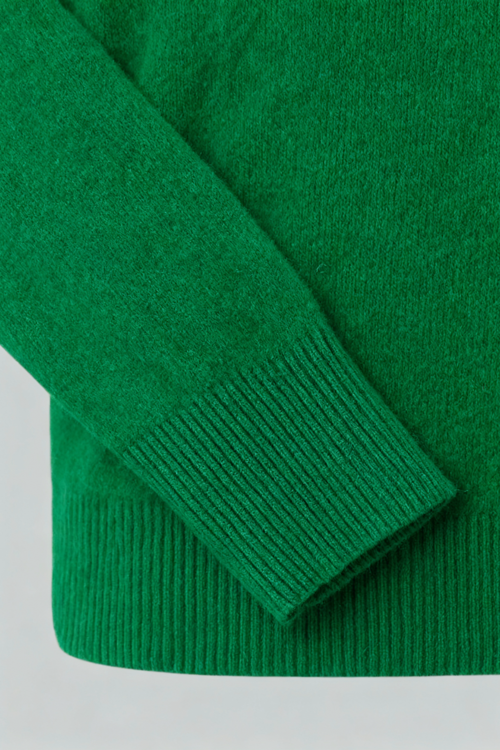 Lumina Wear Sophia green V-neck sweater with fitted silhouette, showcasing soft knit fabric and stylish design in size M.