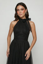 Elegant black long sleeve midi dress from Lumina Wear featuring a flattering silhouette and sophisticated design for women's fashion.