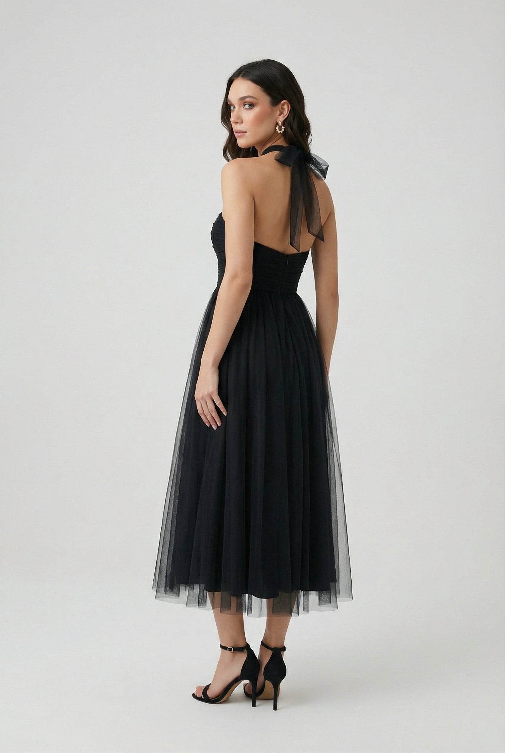 Elegant black long sleeve midi dress by Lumina Wear, featuring a flattering silhouette for women's fashion.