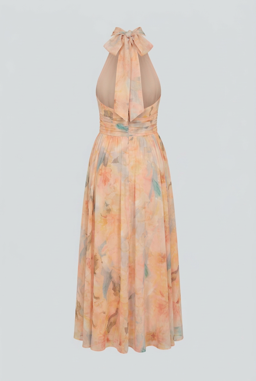 Elegant peach maxi dress by Lumina Wear featuring a flattering silhouette and flowing fabric, perfect for formal occasions.