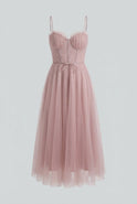 Elegant pink midi dress by Lumina Wear featuring a flattering silhouette, perfect for stylish occasions.