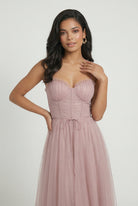 Elegant pink midi dress by Lumina Wear featuring a flattering silhouette, perfect for stylish occasions.