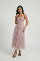 Elegant pink midi dress by Lumina Wear featuring a flattering silhouette and stylish design.