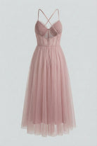 Elegant pink midi dress by Lumina Wear featuring a flattering silhouette, perfect for stylish occasions.