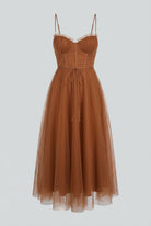 Elegant rust chiffon midi dress with ruffle trim by Lumina Wear, featuring a flowy silhouette and stylish design.