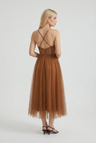 Elegant rust chiffon midi dress with ruffle trim by Lumina Wear, featuring a flowing silhouette and feminine design.