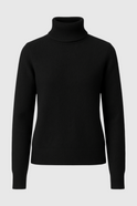 Sophia Lumina Wear slim fit black turtleneck sweater, close-up of soft knit fabric and fitted design on a model.