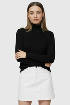 Sophia black slim fit turtleneck sweater by Lumina Wear, close-up of the fitted black sweater with a high turtleneck collar.