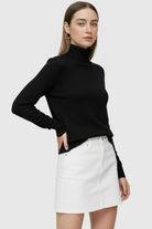 Sophia Lumina black slim fit turtleneck sweater, stylish and elegant, displayed on a model showcasing the sweater's fit and fabric.